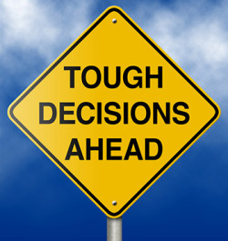 Sign reading 'tough decisions ahead'