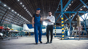 Two engineers in a hangar